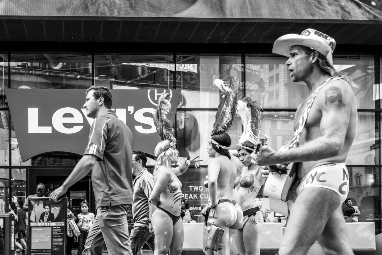 Semi naked guitar slinging cowboy in New York